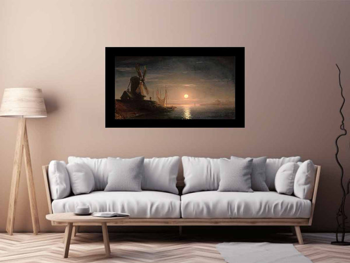 A windmill overlooking a moonlit bay