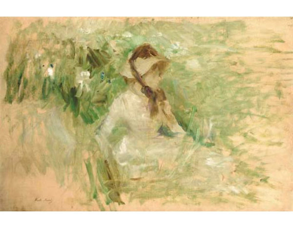 Jeune femme assise dans l'herbe